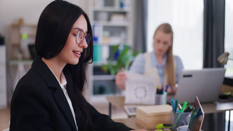 Businesswoman-with-Glasses-Responds-to-Emails