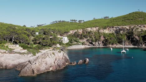 drone shot es canaret beach on coast of ibiza in beautiful summer sun