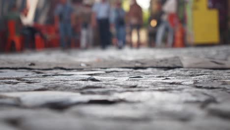 cobblestone street with people