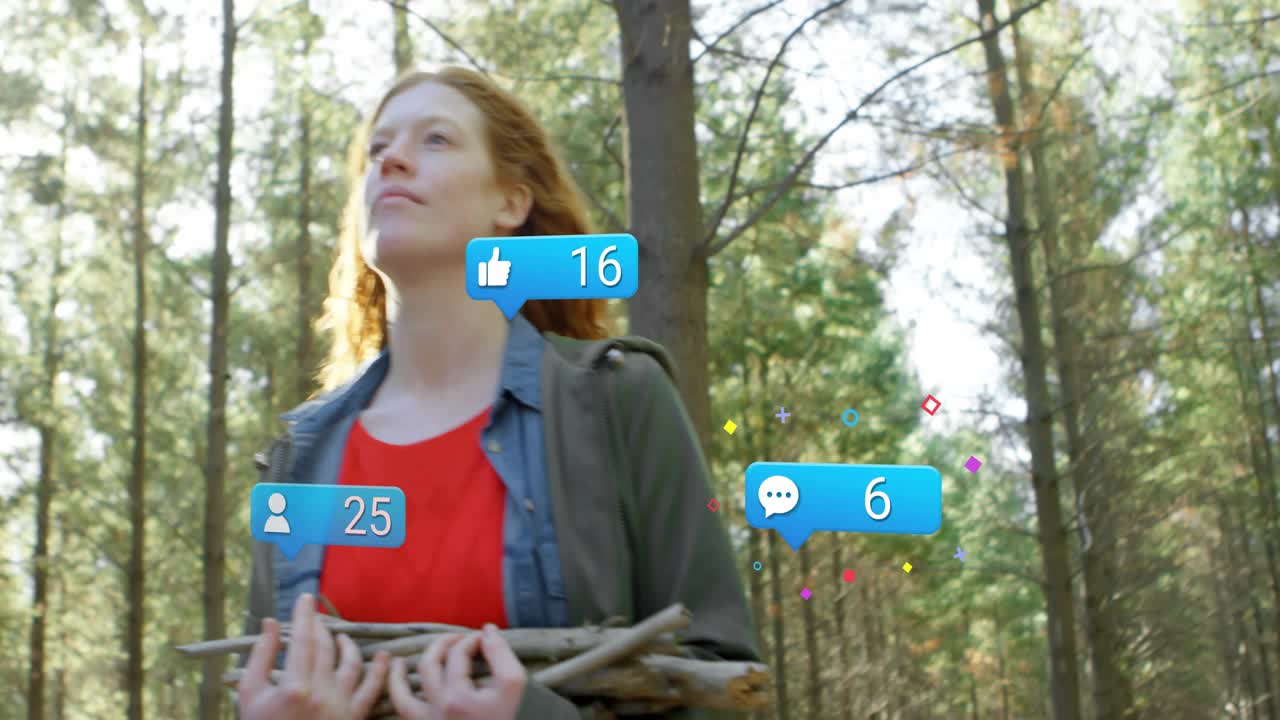 Nainen pitää käsissään keppejä mäntymetsässä, kameran lähentäessä, kuplien puhjetessa ja herättäen sosiaalisen median huomion.