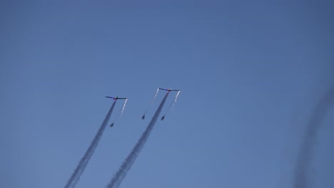 tandem pyrotechnic aircrafts starting their display with sparks and fireworks