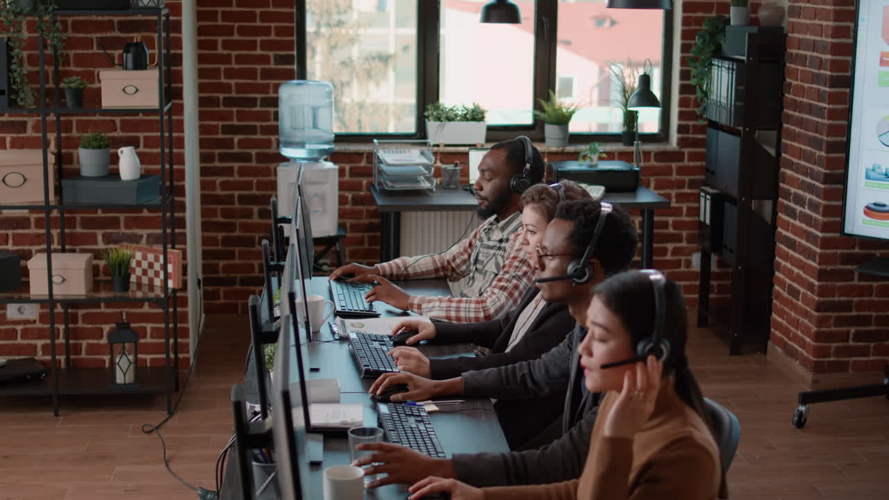 Diverse group of workers talking to clients at customer service