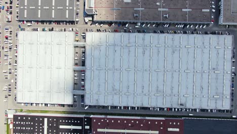 Aerial-footage-of-a-large-shopping-centre-and-car-parks-located-in-the-city