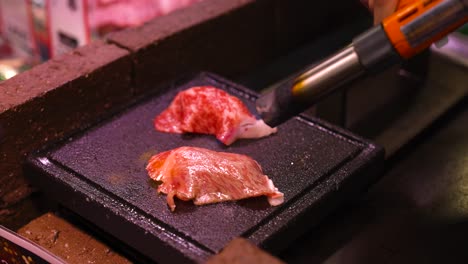 juicy steak being cooked on a sizzling grill