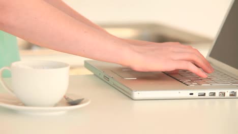 Woman-working-on-her-laptop