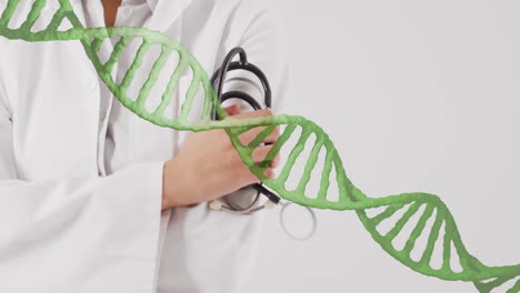 animación de cadena de adn sobre un profesional médico sosteniendo un estetoscopio