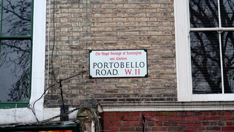 static handheld shot of the street sign of portobello road in london