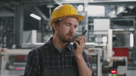 portrait of workman with walkie talkie