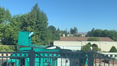 garbage truck emptying trash bin