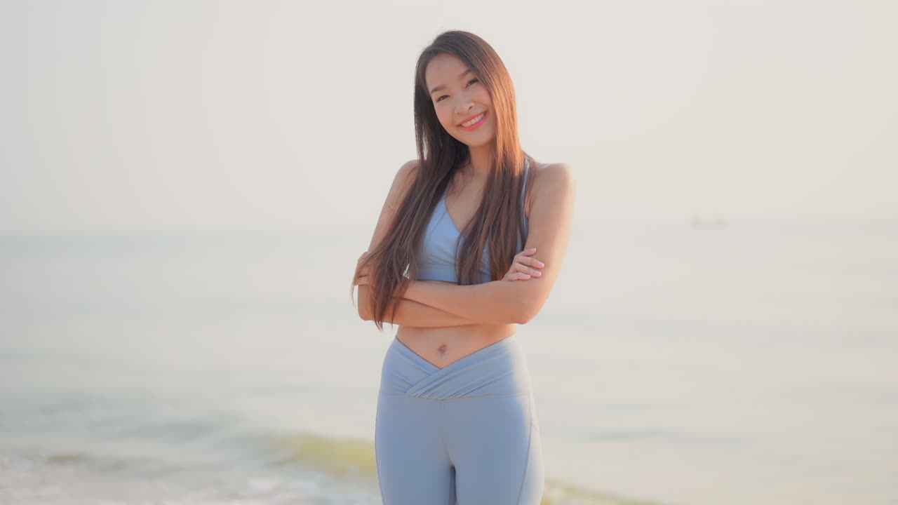 Woman in sportswear on the beach