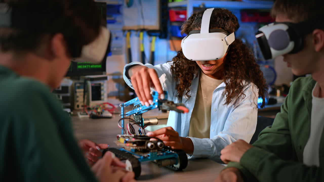 Group of young people in VR glasses doing experiments in robotics in a laboratory. Robot on the table
