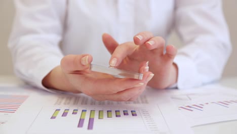 Smartphone-with-transparent-screen-in-human-hands.