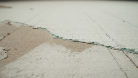 plasterboard with torn coverage and scratches from cutter