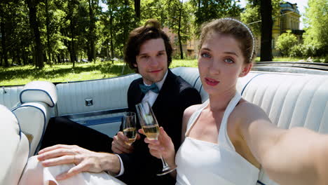 Just-married-couple-in-a-blue-convertible-car