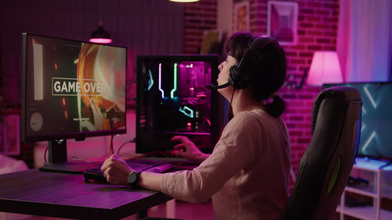 Woman playing online action game angry after losing online competition on gaming pc