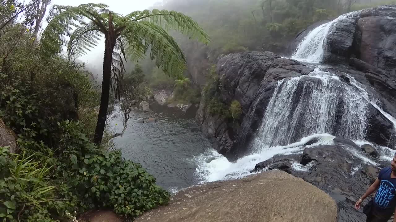 Baker's Falls slow-motion b roll clip, Misty Scenic landscape right to left pan motion in Horton Plains