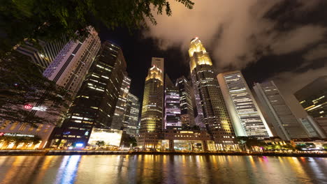 singapore - 5 march 2025 : timelapse of the singapore central business district skyline reflected in the river at night