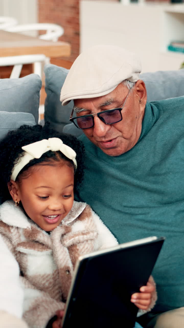 Grandfather and Granddaughter Enjoying Time Together with a Tablet