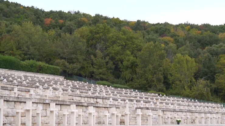 Hillside row of white small stone crosses at Polish cemetery at Monte Cassino, Italy, static