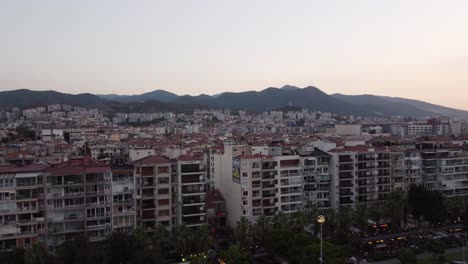 Aerial-video-of-goztepe-izmir-with-mountains-in-the-background-at-sunset