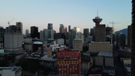 aerial drone footage of downtown vancouver buildings, gastown, early sunrise, morning urban view