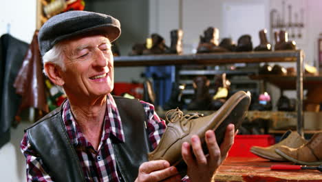 shoemaker examining a shoe