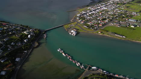 aerial panning view of riverton with channel in the sea