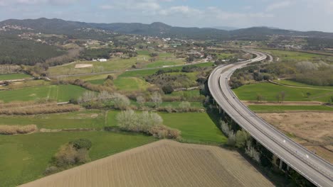 highway passing through cultivated fields in countryside