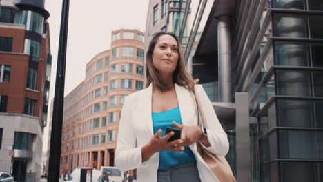 Beautiful-mixed-race-business-woman-walking-through-city