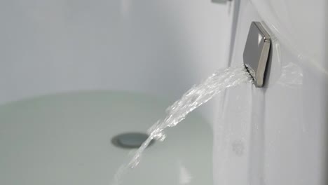 water flowing from a bathtub faucet