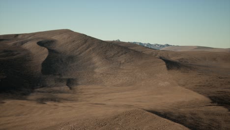 aerial view on big sand dunes in sahara desert at sunrise