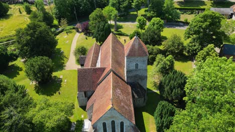 an angled push-in shot towards st lawrence the martyr church in godmersham, kent