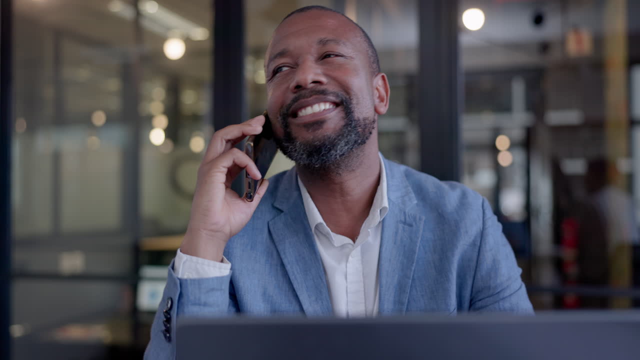 Black man in office, phone call for networking