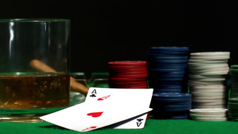pair of aces falling on casino table