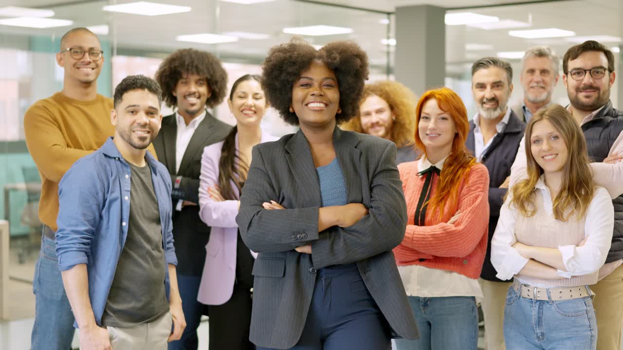African female boss leading employees in a coworking