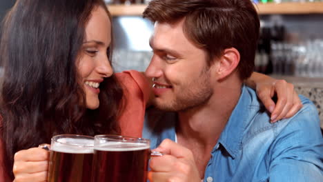 Smiling-couple-having-a-drink-together-