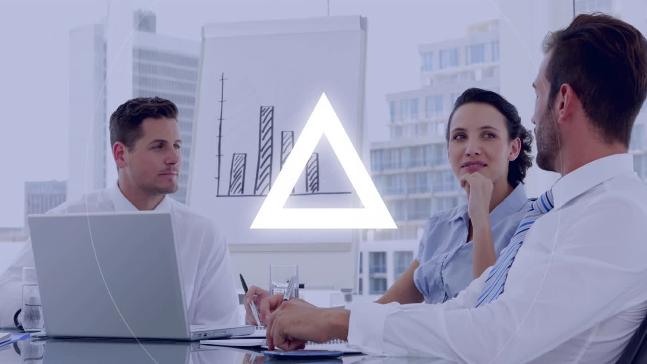 Business team discussing strategy with triangle animation over office meeting