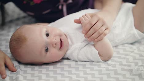 Sister-love-concept.-Infant-baby-smiling-from-sister-kiss.-Lovely-childhood