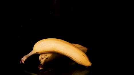 Wet-juicy-fiber-banana-goodness-dripping-on-black