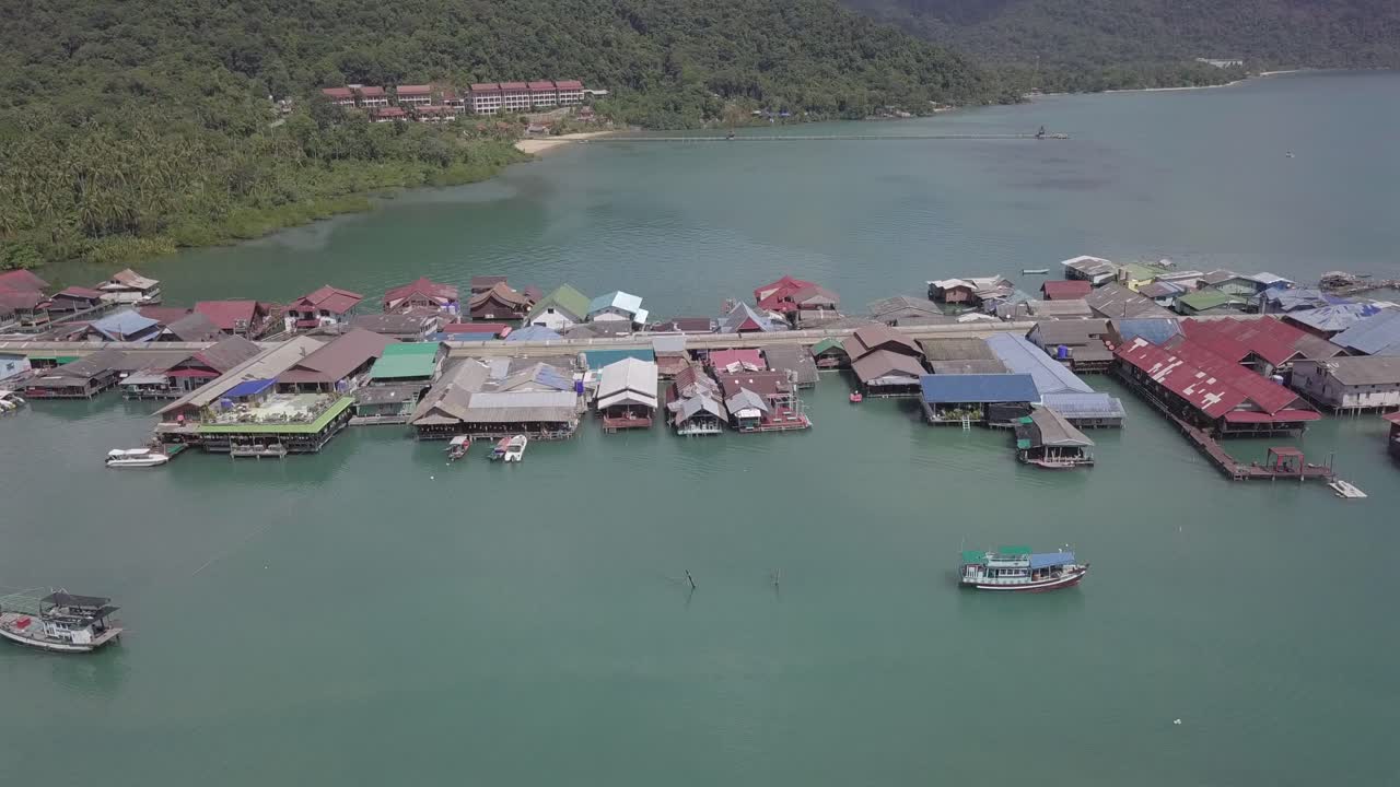 Aerial view towards and over the Bang Bao floating village with colorful houses and roofs at Koh Chang,Thailand on a sunny day.