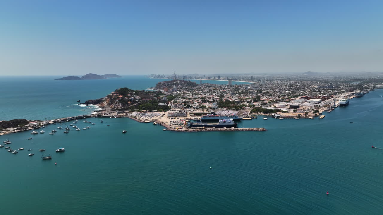 Establishing drone shot approaching the Port of Mazatlan, in sunny Sinaloa, Mexico