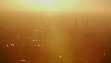 silhouette of milan city during golden sunset or sunrise with lens flare