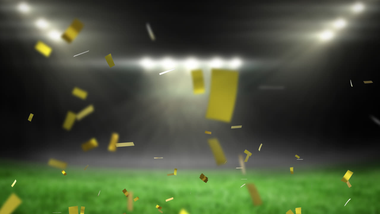 빈 스포츠 경기장 위에 떨어지는 황금색 콘페티의 애니메이션