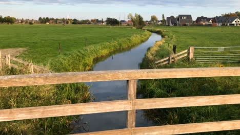 movement on the bridge over the river and view of the village