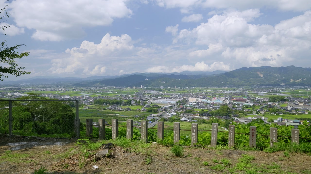 Calm cinematic locked off view over natural panorama in Japanese countryside