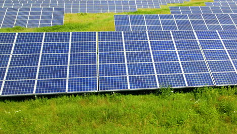 aerial sliding over blue solar panels on greenland field poland gdansk