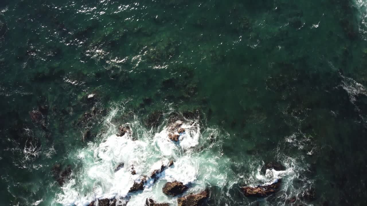 Slow Motion Birds Eye View POV of the ocean in Asilomar Beach in Monterey