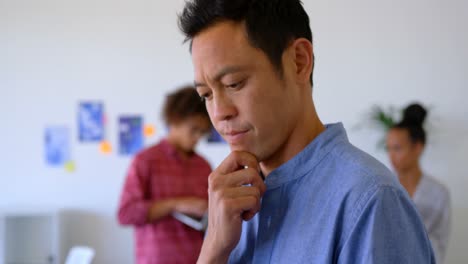 asian male executive using digital tablet in modern office 4k