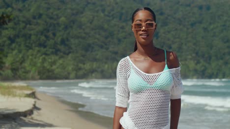 Bikini-girl-walking-on-a-white-sand-beach-on-a-tropical-Caribbean-island