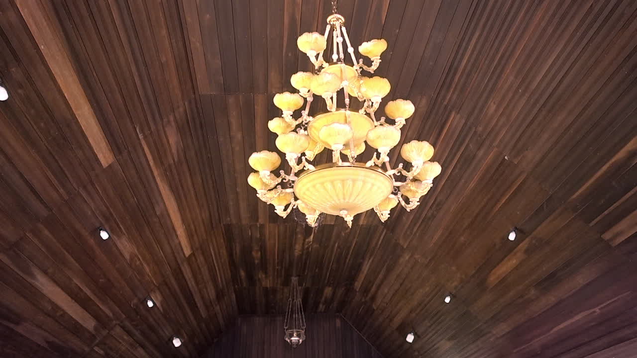 Chandelier hangs from the wooden roof of a Dayak longhouse in Borneo.